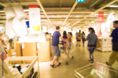Blurred store of interior decoration with people