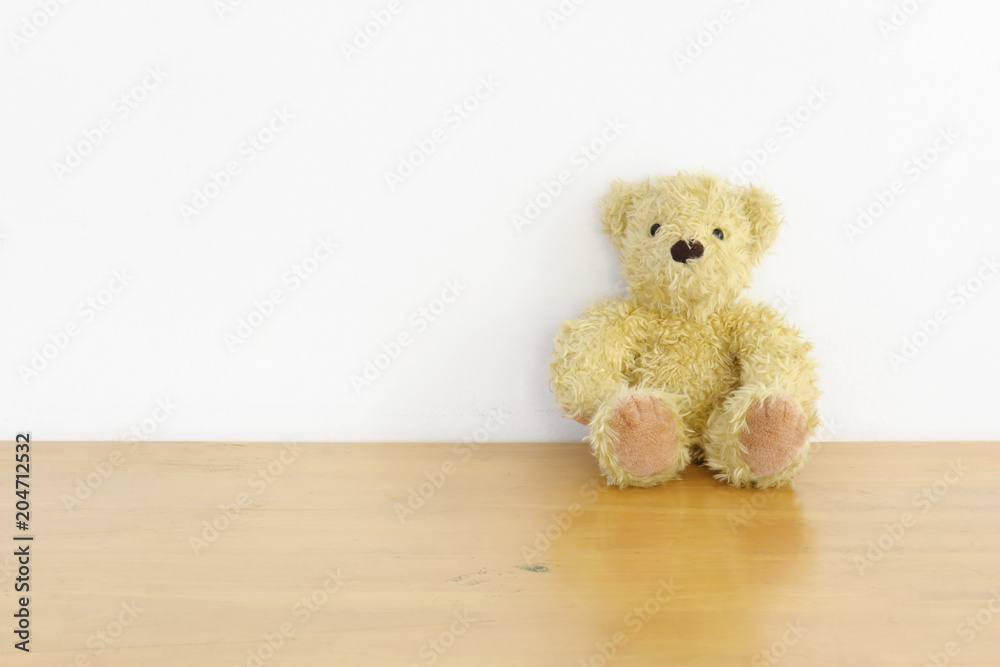 brown teddy bear on wood brown teddy bear on wood