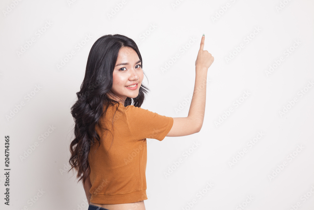 Back of Asian woman touching the screen with her finger. Back of Asian woman touching the screen with her finger.