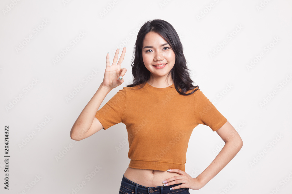 Young Asian woman show OK sign. Young Asian woman show OK sign.