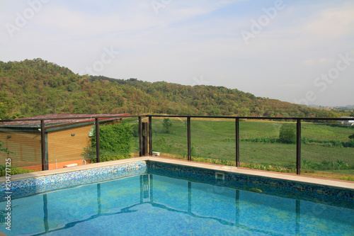 view blue swimming pool outdoor resort on blue sky landscape background