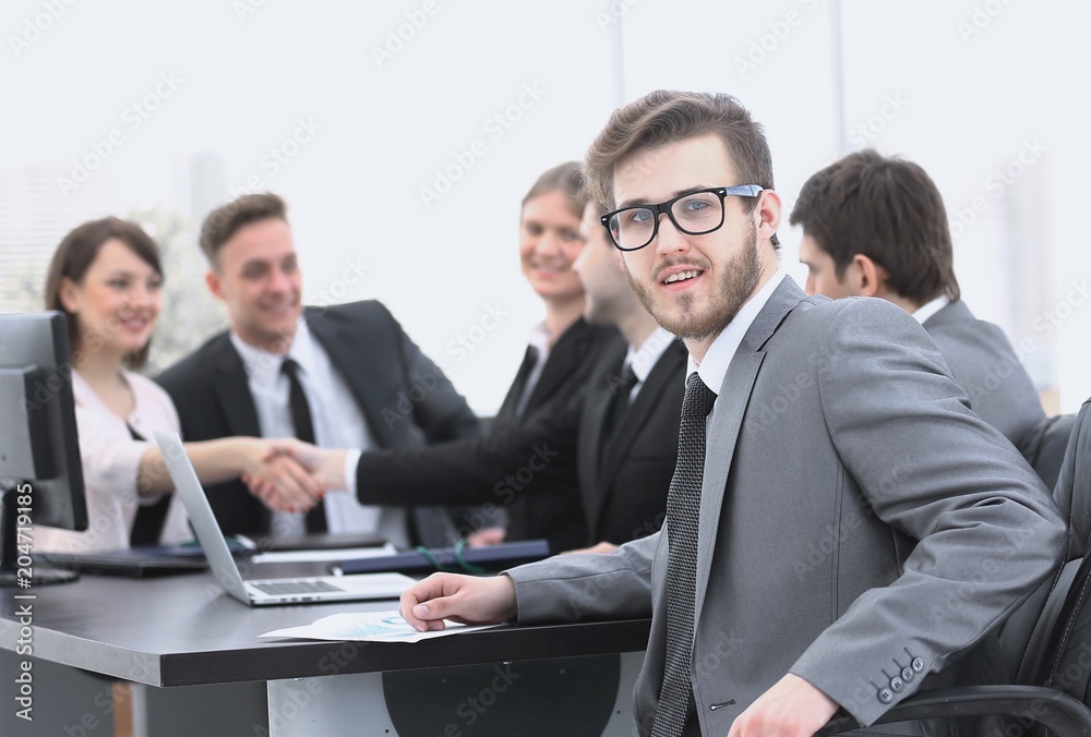 handshake business partners with the Manager in the foreground handshake business partners with the Manager in the foreground