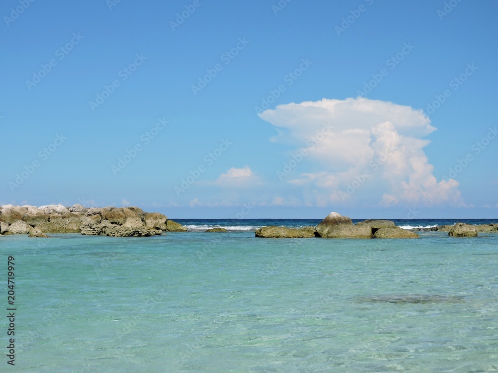 Turquoise water and rocks at a beach, Bahamas Turquoise water and rocks at a beach, Bahamas