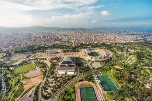 Barcelona aerial wide angle panorama, Anella Olimpica sport complex with city skyline , Spain
