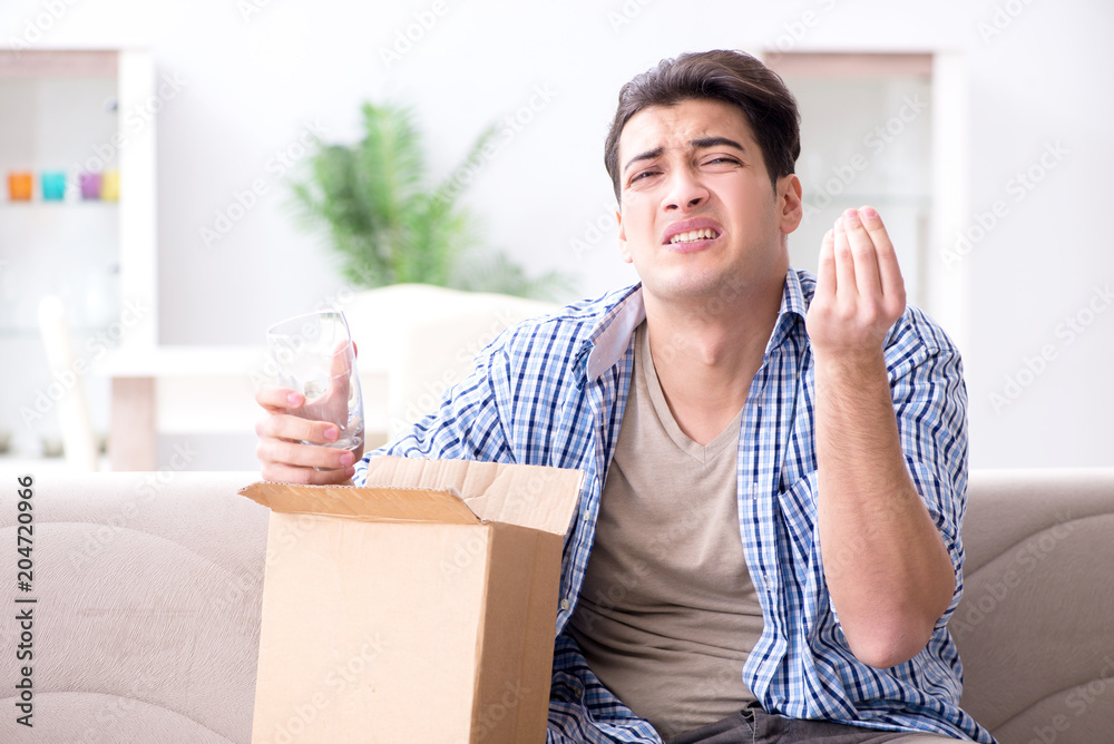 Man receiving wrong parcel with glasses