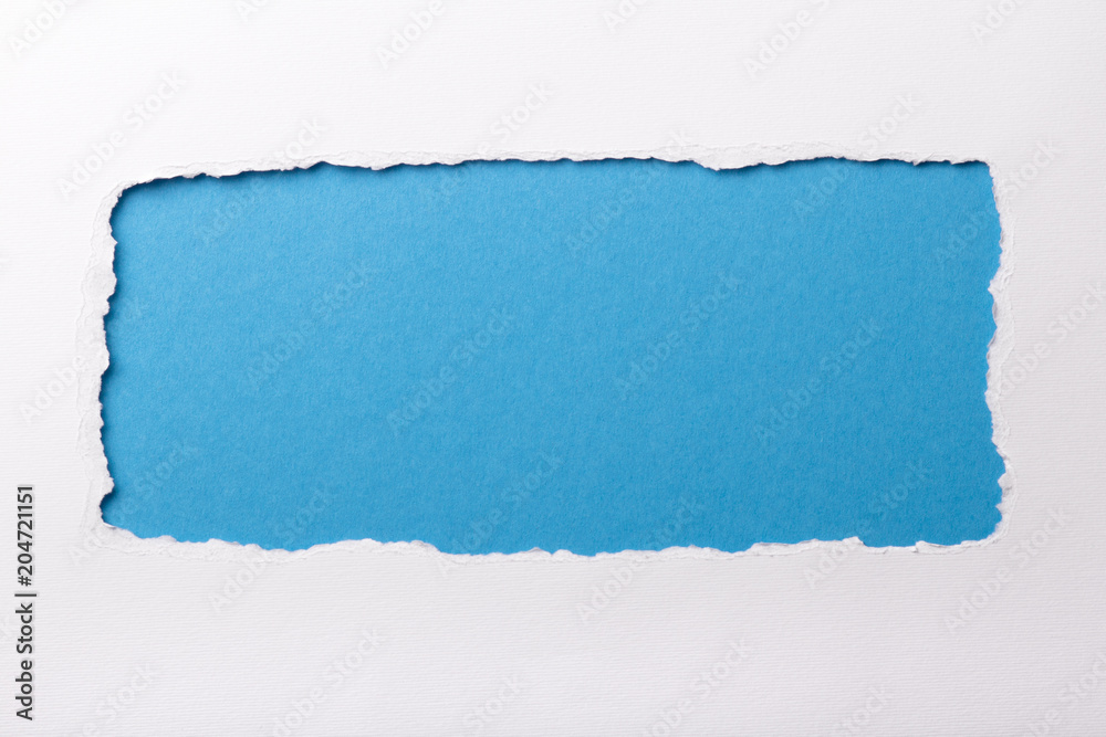 Ripped white paper with colored background with space for text Ripped white paper with colored background with space for text