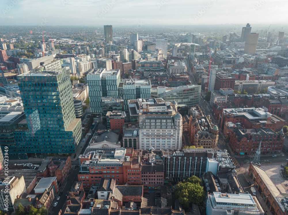 Naklejka premium Manchester City Centre Drone Aerial View Above Building Work Skyline Construction Blue Sky Summer Beetham Tower Deansgate.