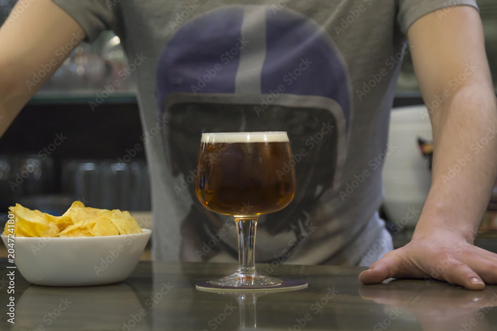 waiter with beer glass and chips in the pub waiter with beer glass and chips in the pub