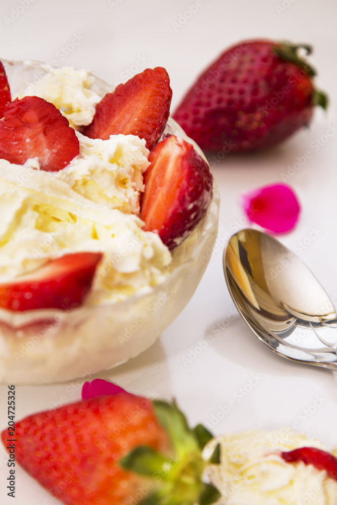 glass bowl of strawberries with cream glass bowl of strawberries with cream