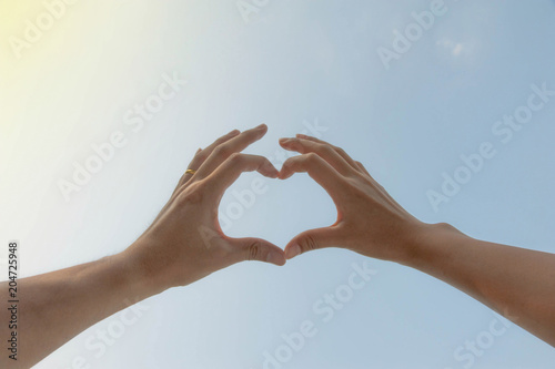 Love,Signs of the hand mean love,men and women using hand made heart shape,valentine