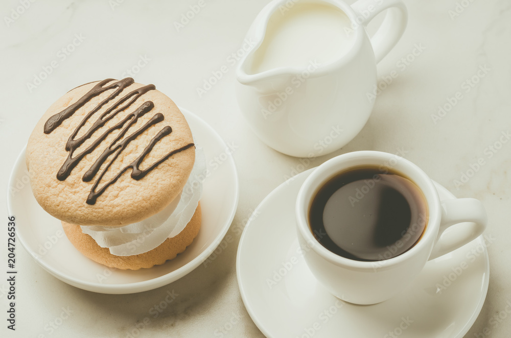Espresso with dessert and milk on white background/Espresso with dessert and milk on white marble background, top view Espresso with dessert and milk on white background/Espresso with dessert and milk on white marble background, top view