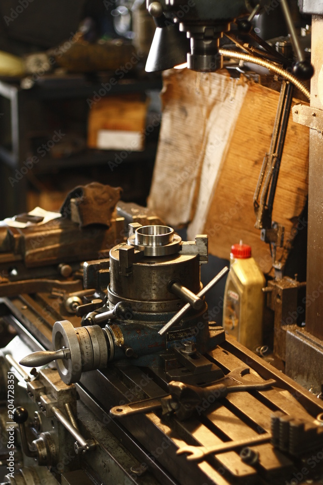 Metal engine parts being drilled, bored and lathed in a metal engineering workshop in Thailand, Southeast Asia Metal engine parts being drilled, bored and lathed in a metal engineering workshop in Thailand, Southeast Asia