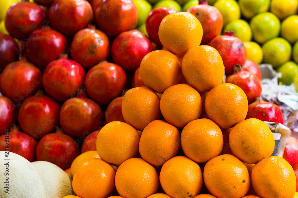 Fruit stall precisely arranged in pyramid shape at Devaraja market in Mysore, Karnataka, India