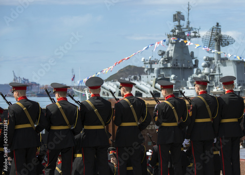 military cadets in military service against the backdrop of a military ship