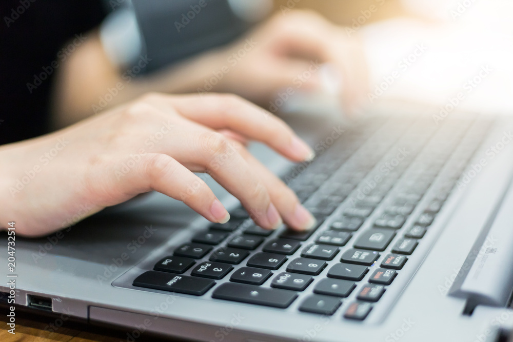 close up hand of businesswoman typing keyboard on laptop. business people and technology concept.