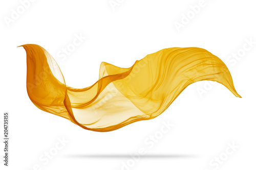 Piece of flying golden cloth on white background photo