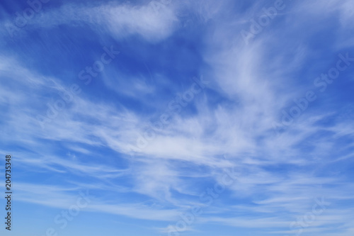 beautiful blue sky, airy white clouds, free space for text
