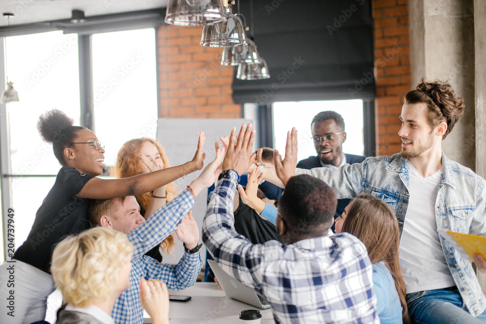 © alfa27 - young people doing pantomime in the room. touch unreal thing together. check energy