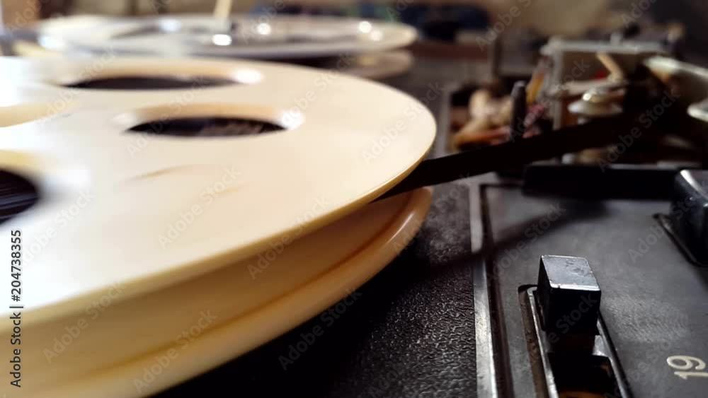 Old retro Reel Audio Recorder reels spinning Old retro Reel Audio Recorder reels spinning