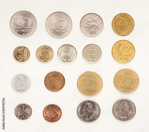 Set of coins of different countries on white