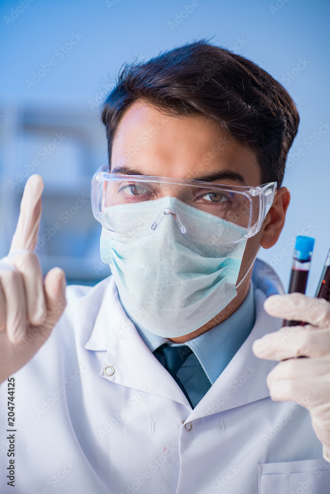 Lab assistant testing blood samples in hospital Lab assistant testing blood samples in hospital