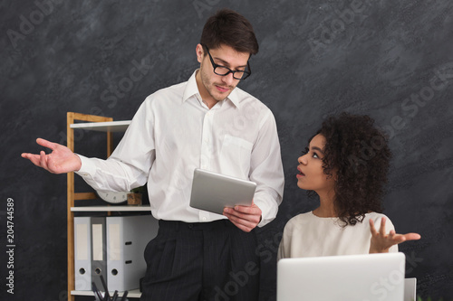 Couple of business partners work at modern office