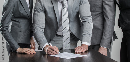 Business people sign contract