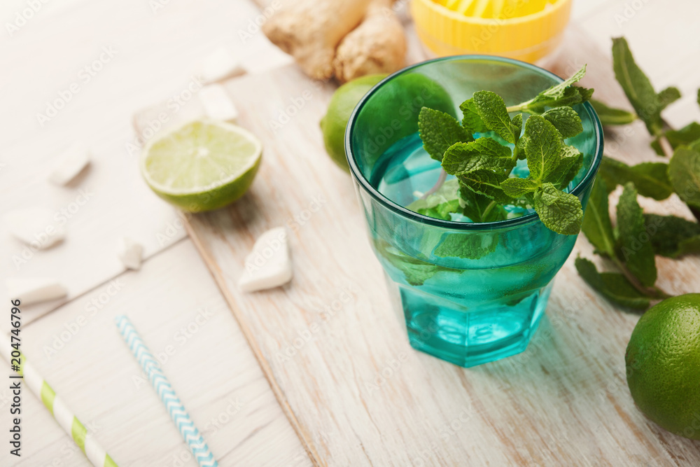 Making lemonade at home, ingredients on white wooden table Making lemonade at home, ingredients on white wooden table