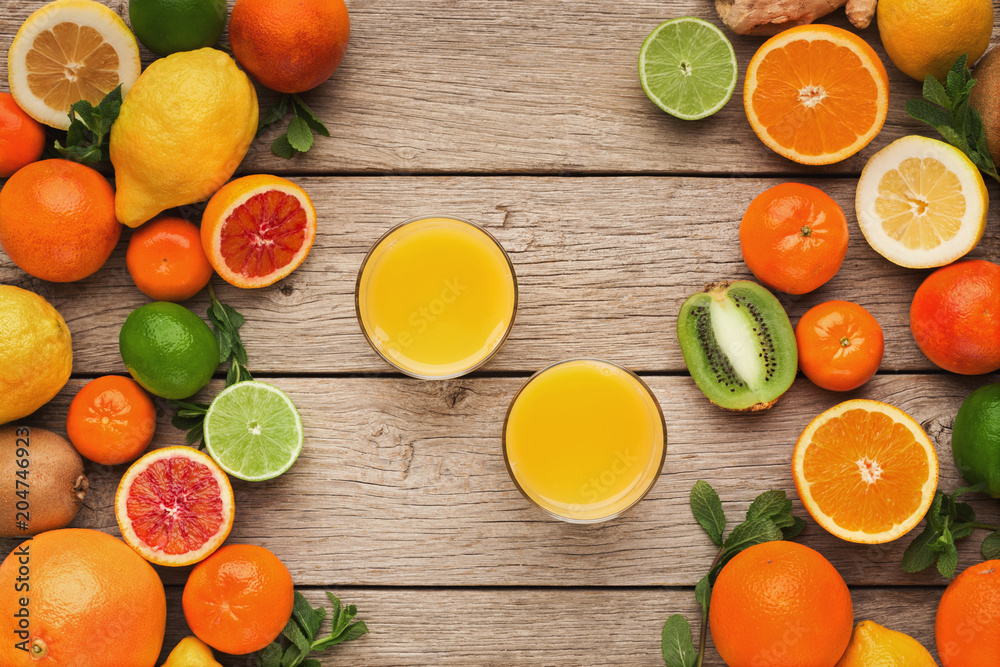 Variety of ripe citruses on wooden background Variety of ripe citruses on wooden background