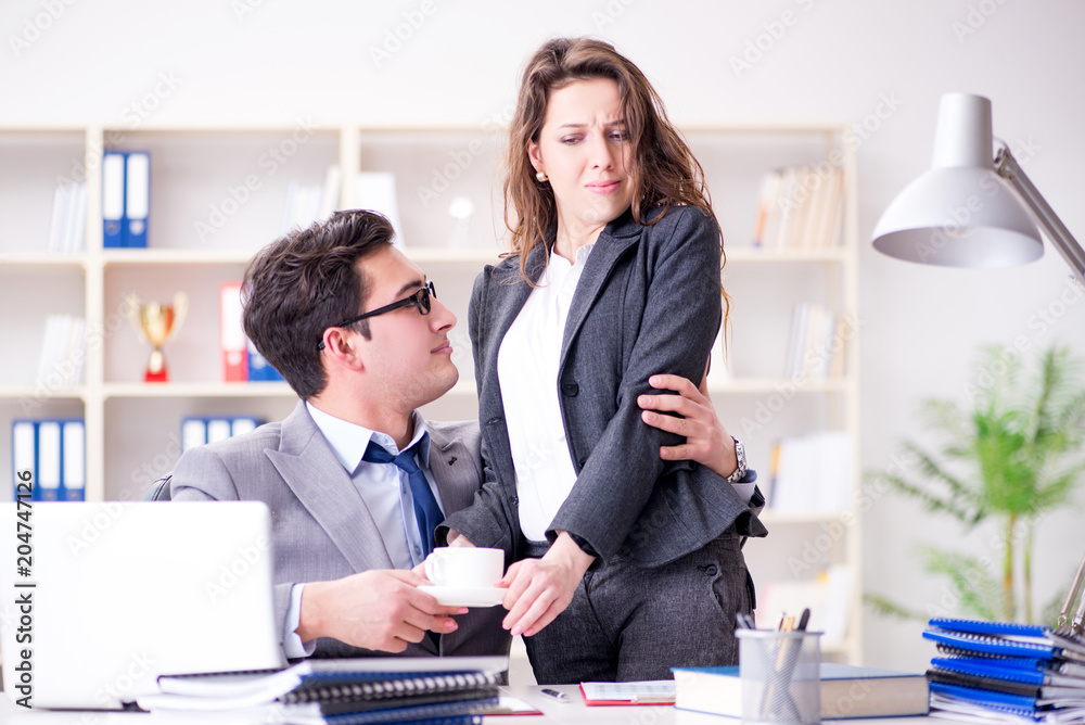 Sexual harassment concept with man and woman in office Sexual harassment concept with man and woman in office