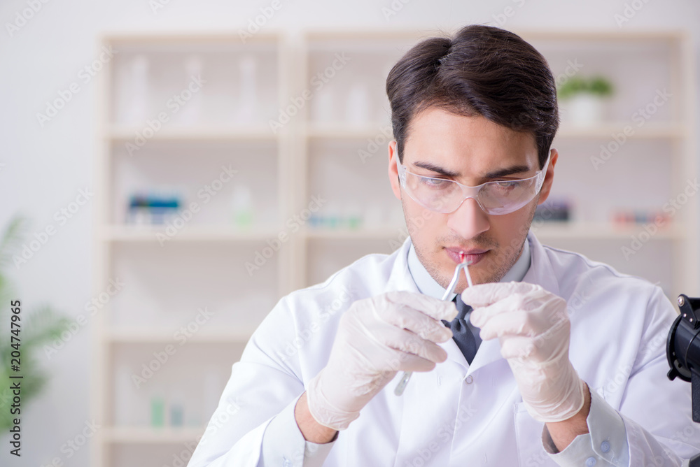 Expert criminologist working in the lab for evidence Expert criminologist working in the lab for evidence