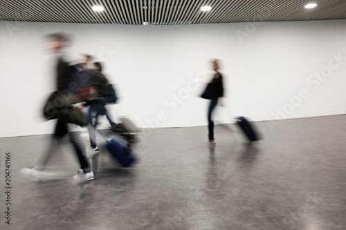 blurred people at the airport