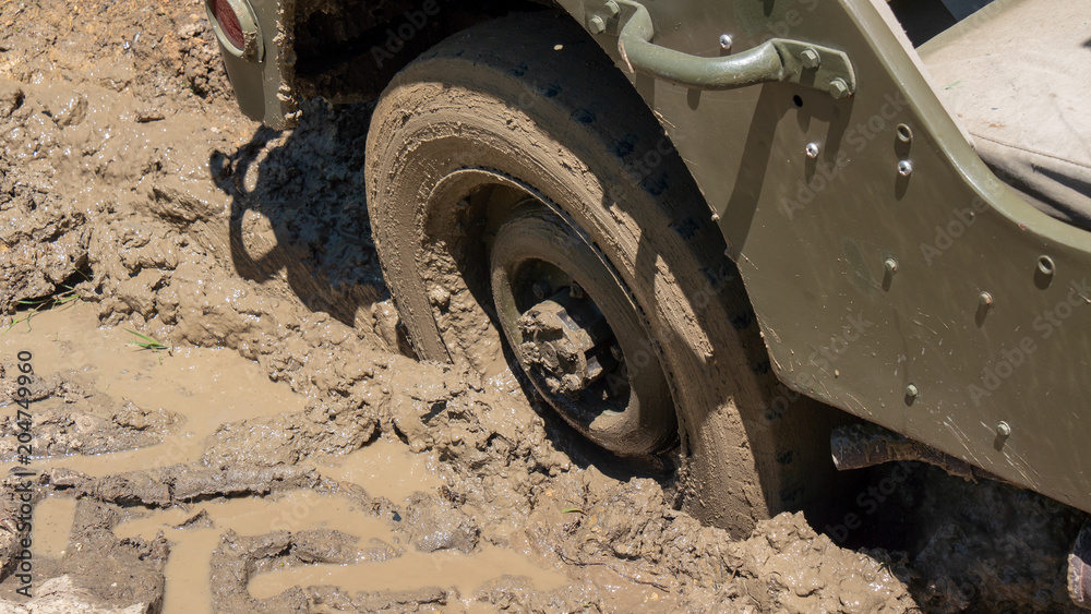 wheel of military vehicle in the mud