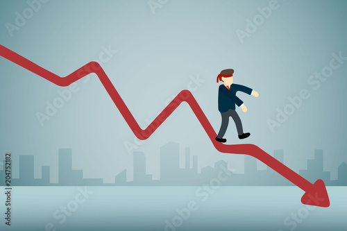 businessman with blindfold walking on downward graph.