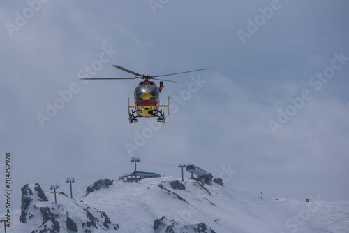 Helicopter of the civil security in the French Alps resort in the sky