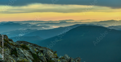 Fototapeta Naklejka Na Ścianę i Meble -  Mountain mist at sunset.