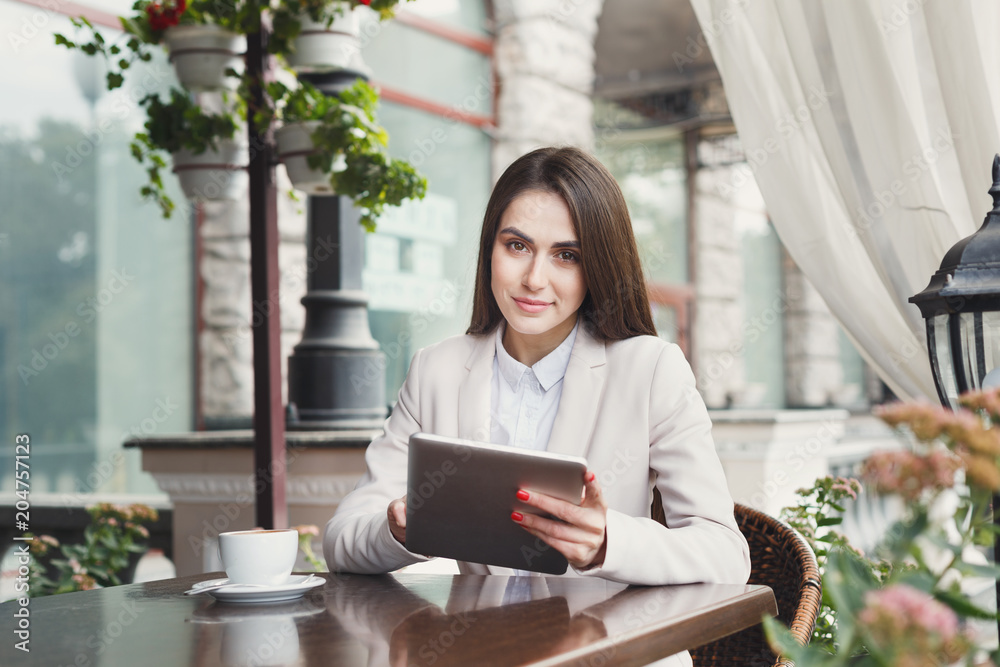 Young businesswoman outdoors working with laptop Young businesswoman outdoors working with laptop