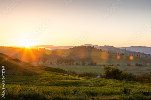 Beautiful sunrise over countryside near Siena, Tuscany, Italy
