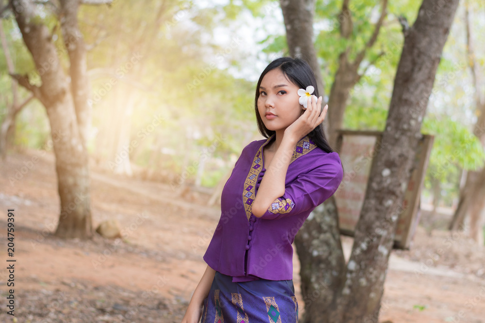 Beautiful Laos girl in Laos costume ,Asian woman wearing traditional Laos culture,vintage style,traditional suit. Beautiful Laos girl in Laos costume ,Asian woman wearing traditional Laos culture,vintage style,traditional suit.