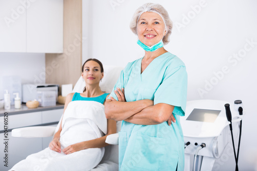 Female beautician in clinic of esthetic medicine