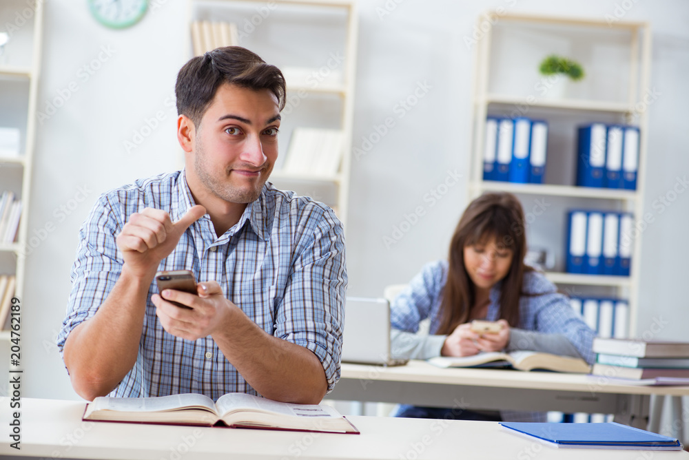 Students sitting and studying in classroom college Students sitting and studying in classroom college