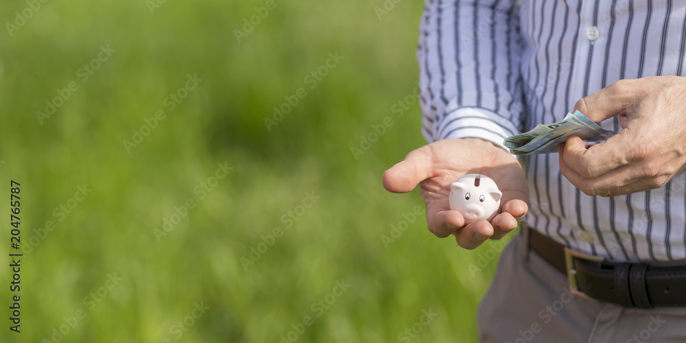 Cute little piggy bank in your hand Cute little piggy bank in your hand