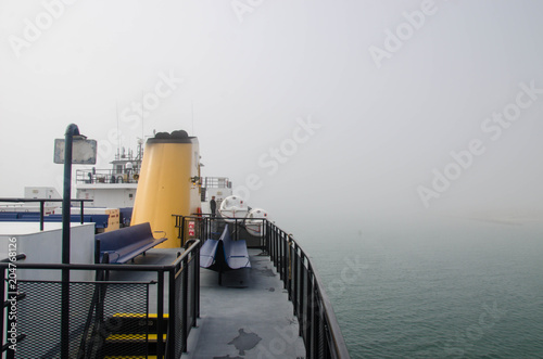 Картината върху платно Passenger ferry travels through fog