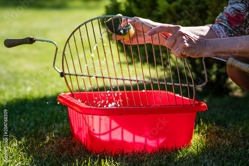 Cleaning up the grill after a barbecue