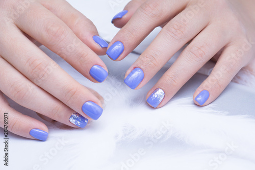 Attractive manicure on women s hands. Natural finger nails with stylish nail art.