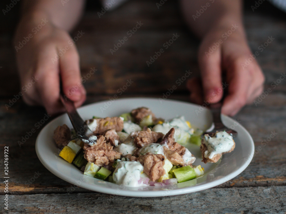 Cod liver and vegetables salad (seafood salad) - healthy food (fresh vegetable set).  Food background