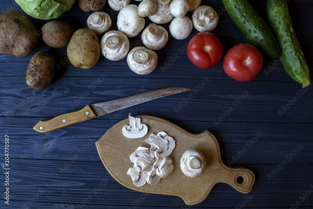 Fototapeta premium Vegetables on a rustic table. Organic ingredients for cooking.