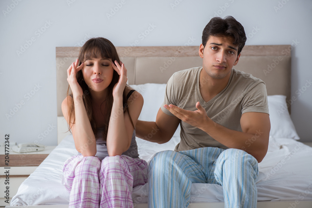 Woman and man in the bedroom Woman and man in the bedroom