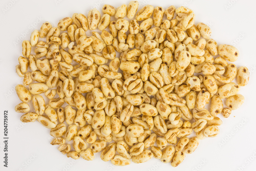 heap of puffed wheat cereal with honey heap of puffed wheat cereal with honey