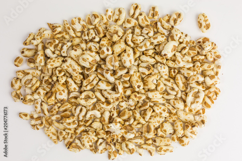 heap of puffed spelt cereal with honey